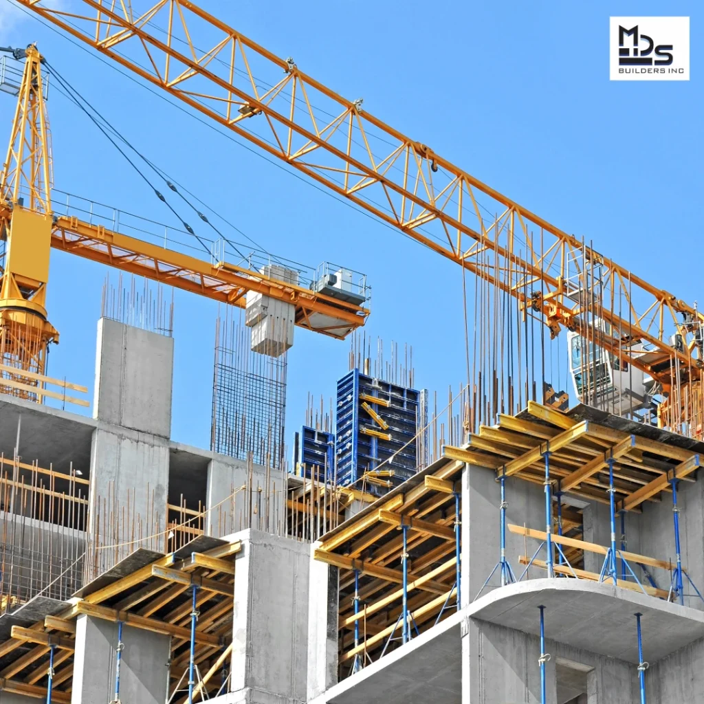 - GiaSpace: IT Support & Cybersecurity for Florida Businesses Construction site with a large yellow crane over a partially built concrete structure and exposed rebar.