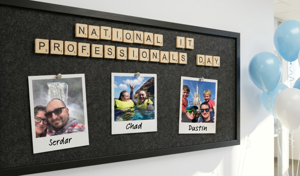 Board spelling 'National IT Professionals Day' with wooden letters; photos of Serdar, Chad, and Dustin pinned below and blue balloons nearby—celebration display.